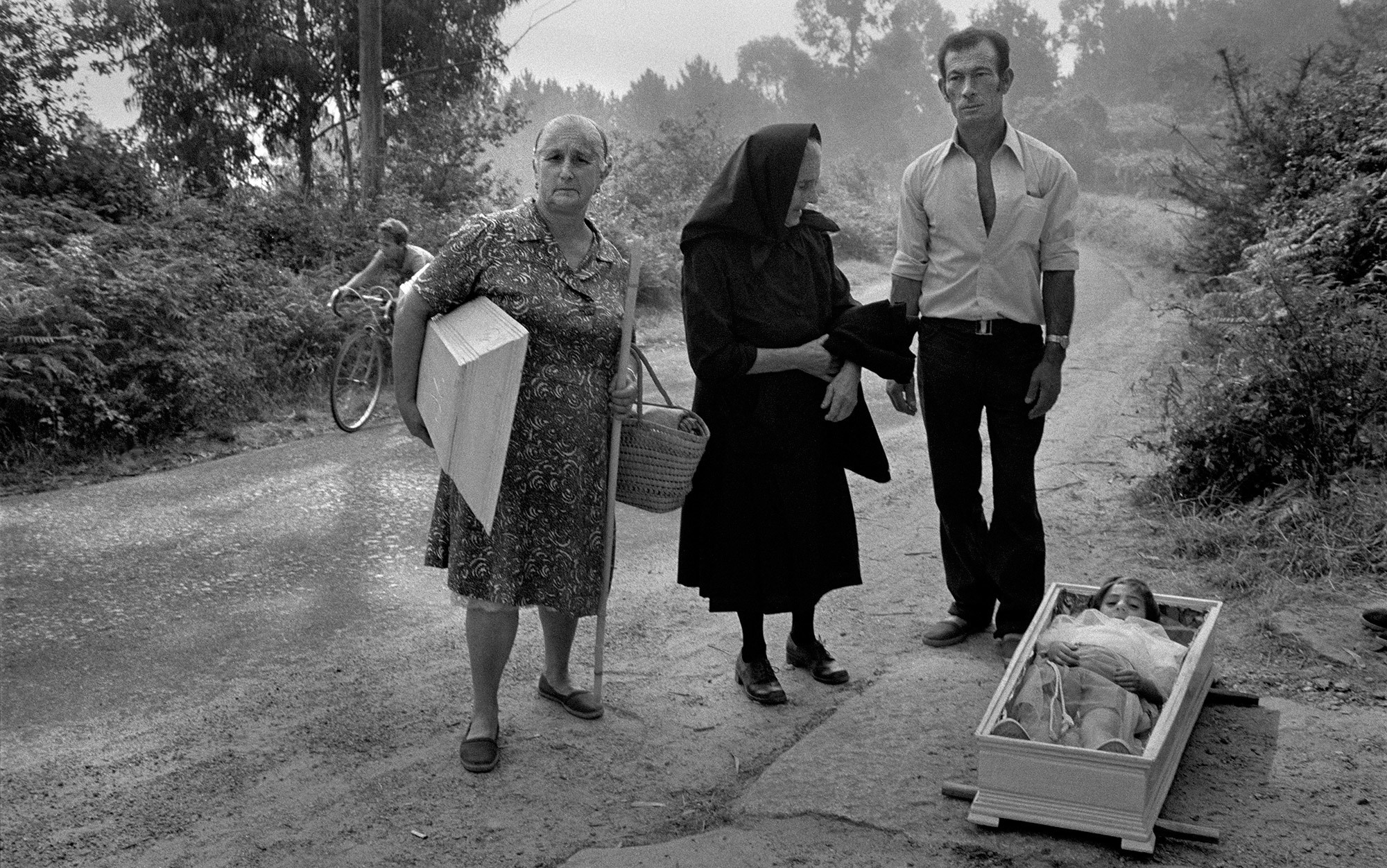 Two women and and a man with dead child